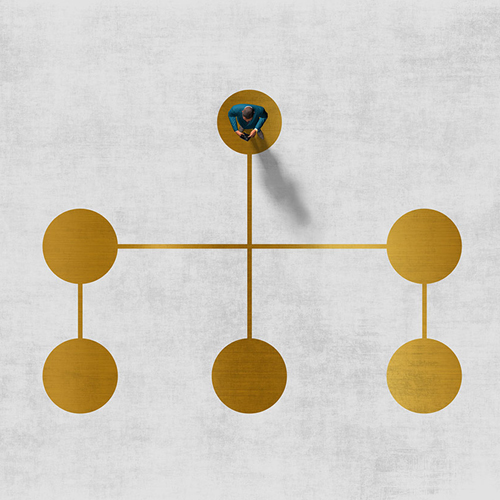 gold tree diagram with person standing at the top