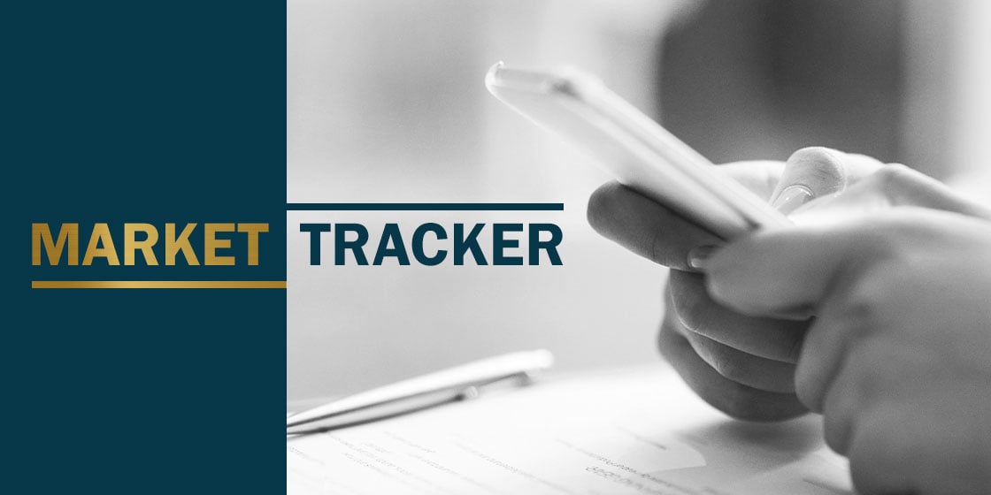 Black and white image of hands holding phone rested on desk with pen and papers next to navy and gold graphic that reads 