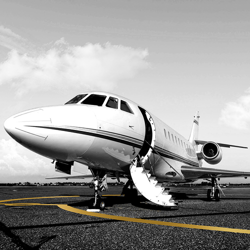 Private jet on a runway with door open