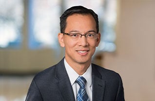 Headshot of Commerce Trust's Koji Watanabe.
